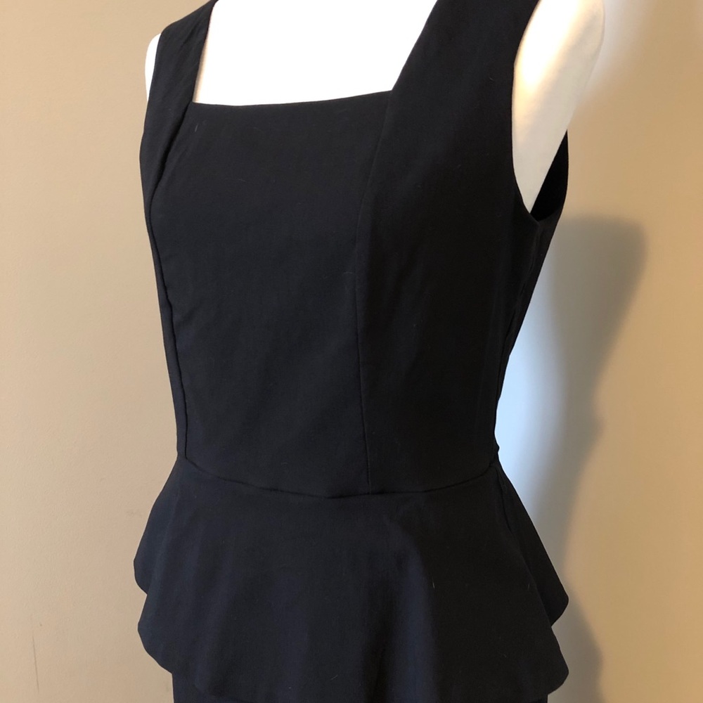 Black peplum knee length dress